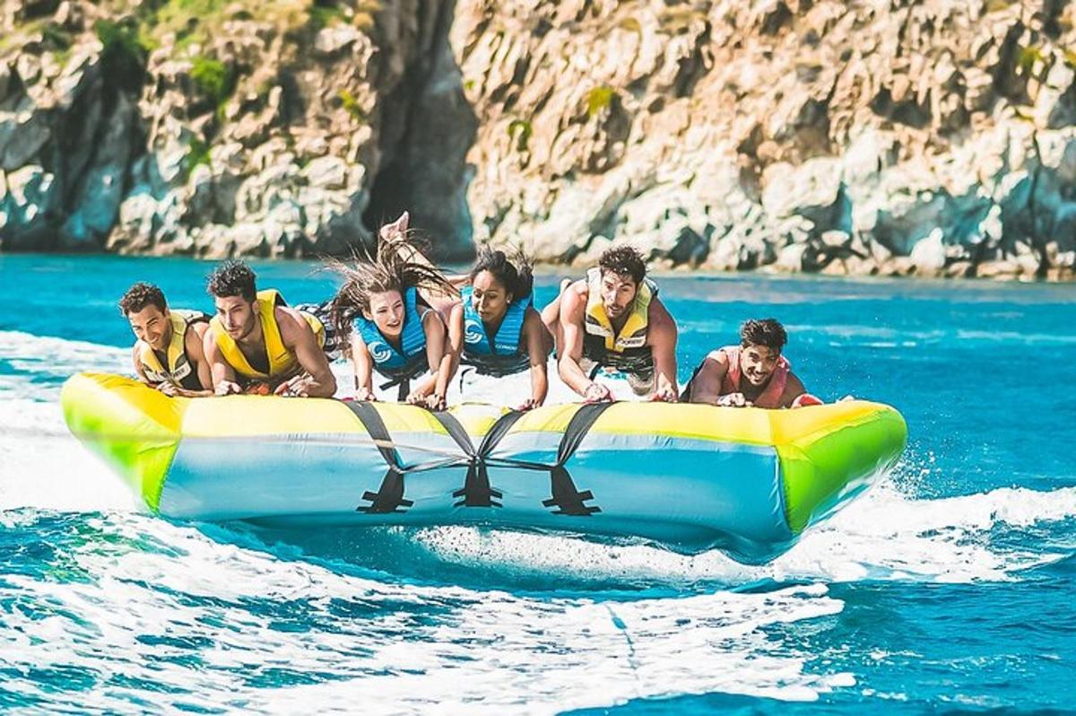 a group of people on a raft in the water