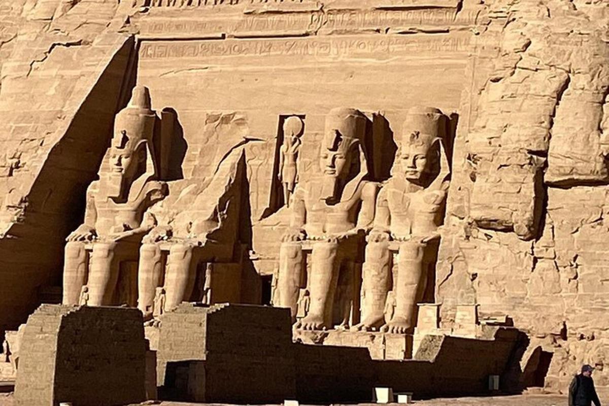 a statue of a group of statues on a wall