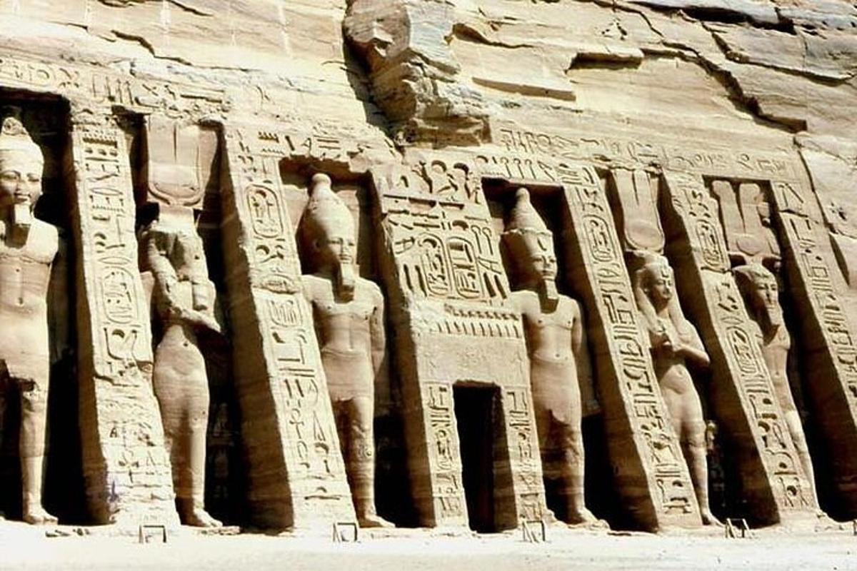 a stone relief ofaraohs on the side of a wall