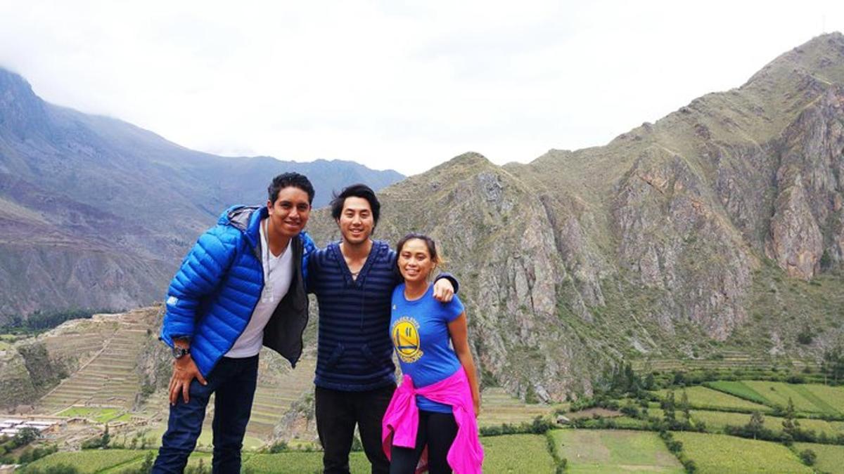 a group of people standing on top of a mountain