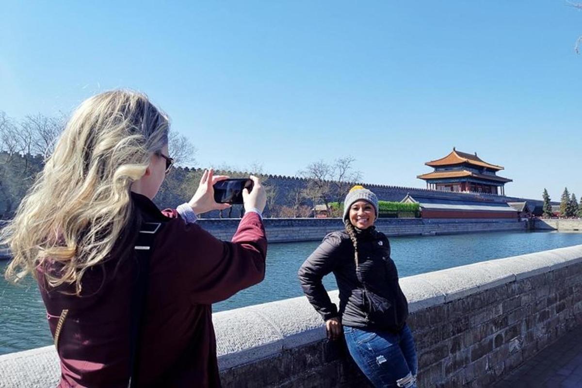 a woman taking a picture of another woman with a camera