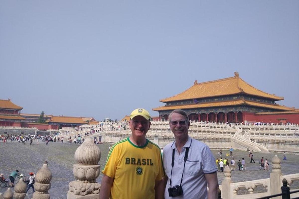 two men are standing in front of a building