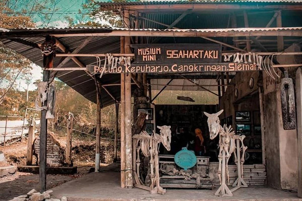 một ki-ốt có những con hươu cao cổ đứng trước nó