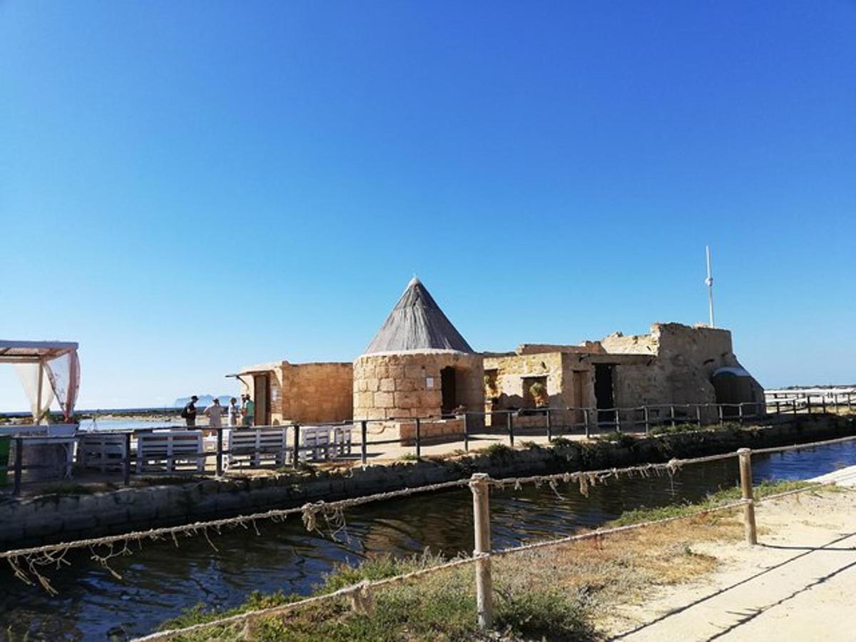 an old building next to a body of water