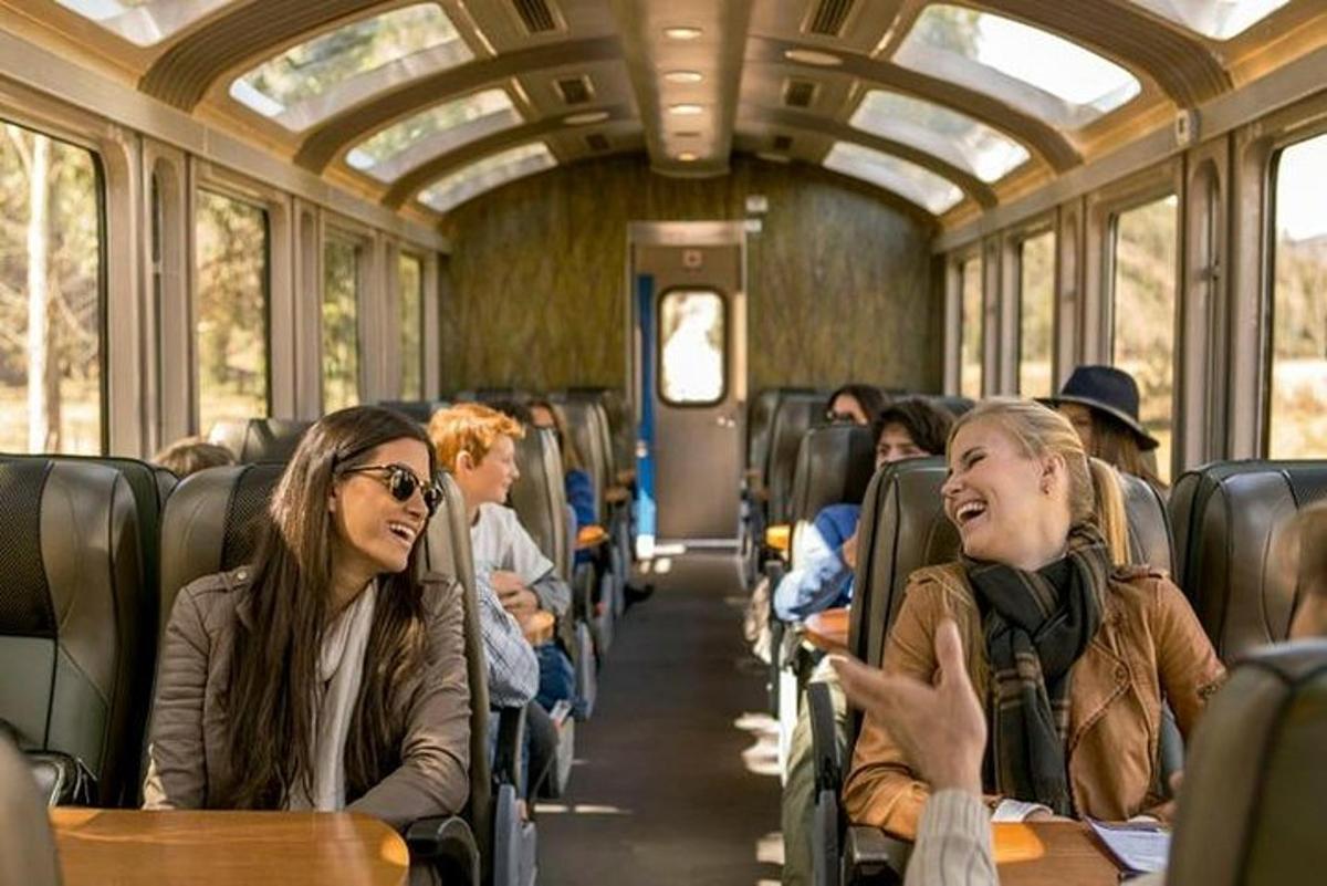 a group of people sitting on a train
