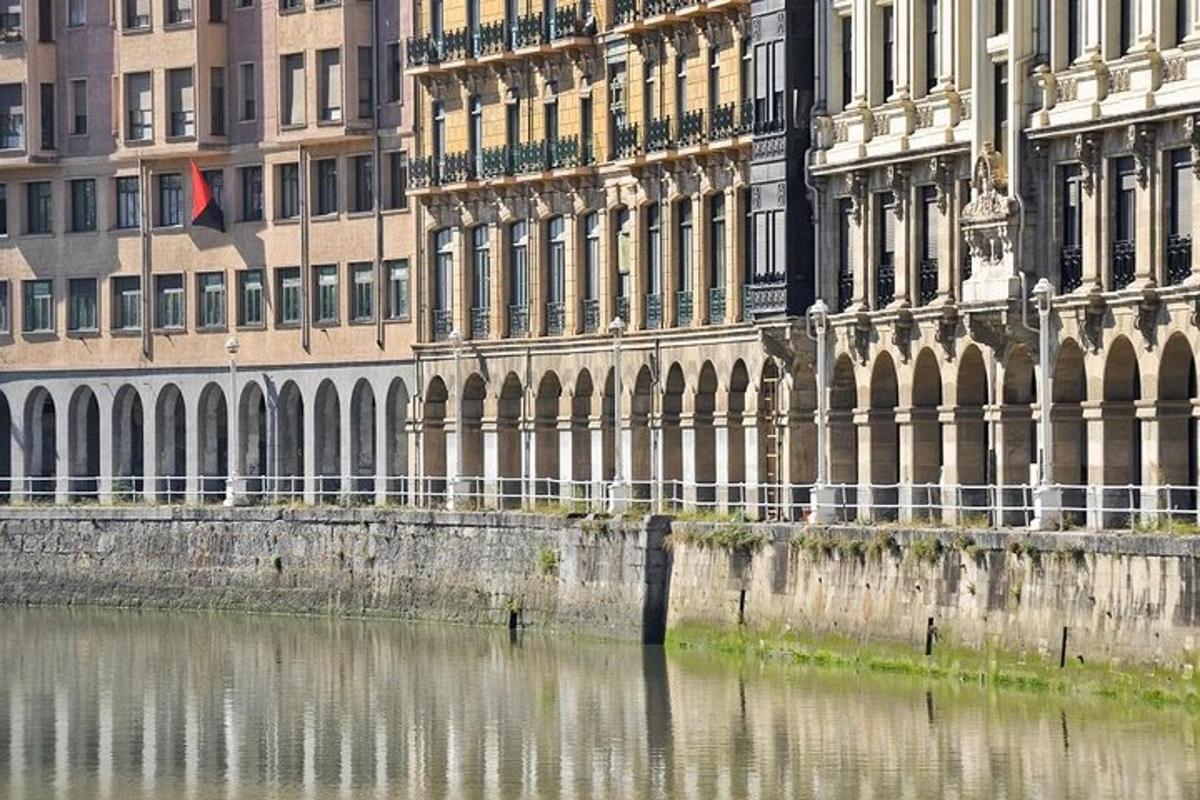 a building next to a body of water with buildings
