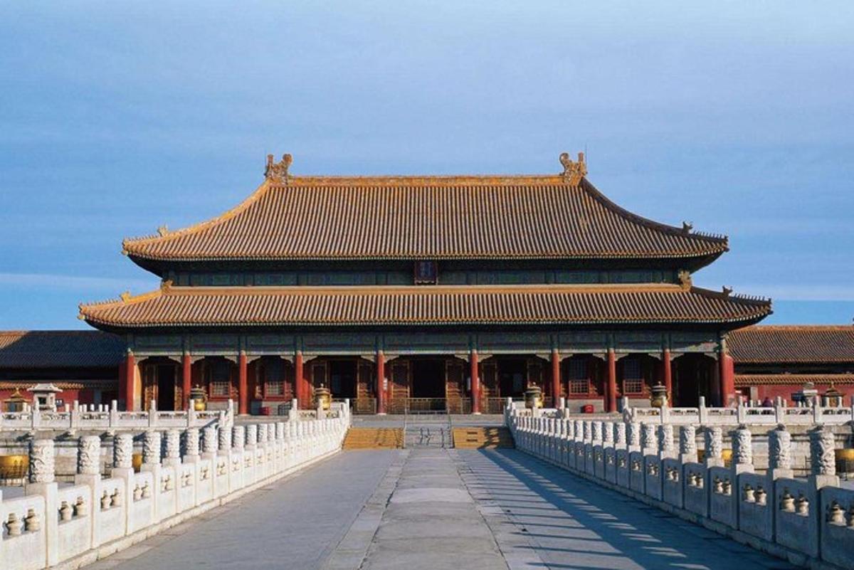 a large building with a fence in front of it