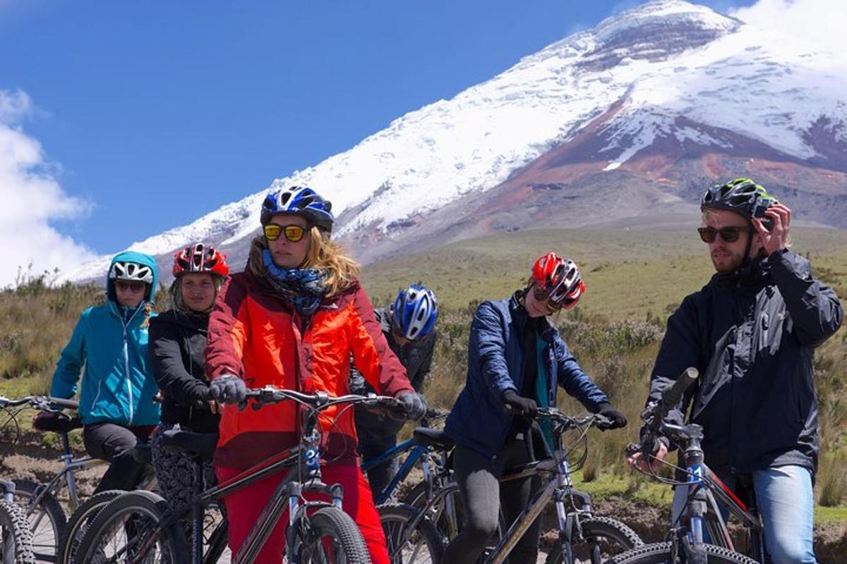 a group of people on bikes in front of a mountain