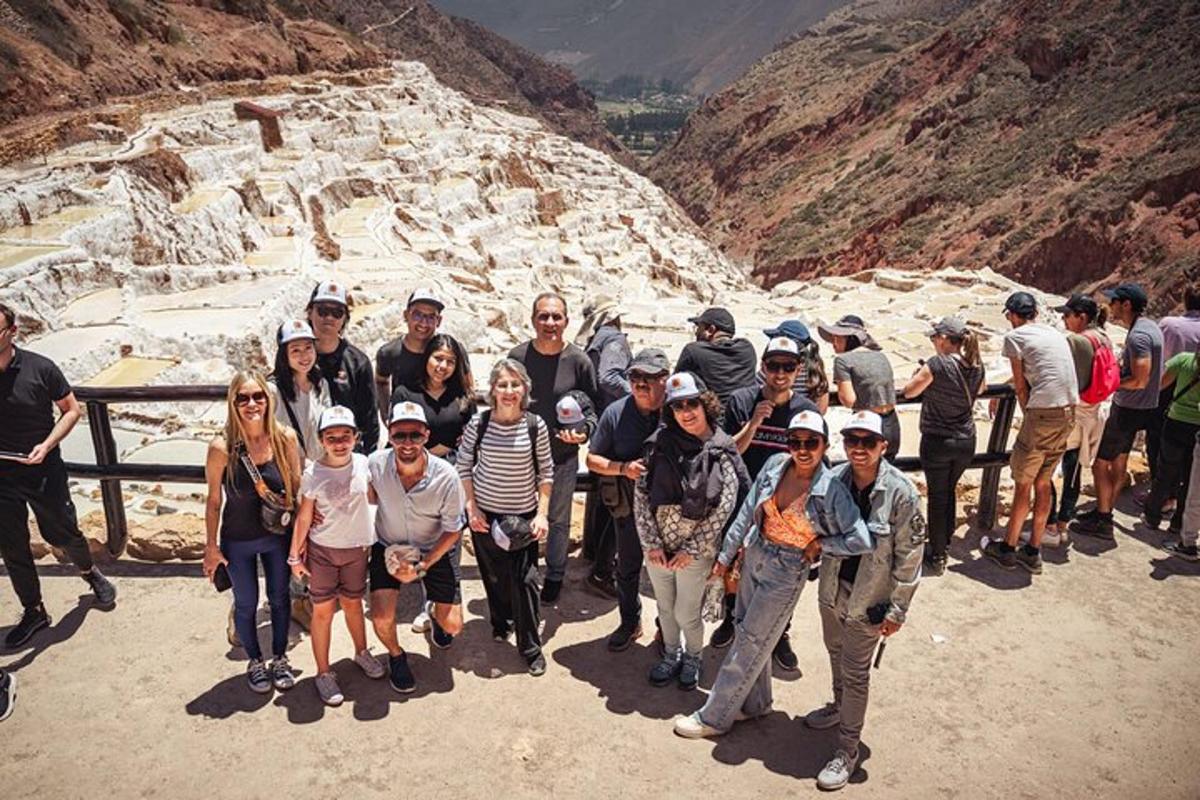 a group of people posing for a picture at a canyon