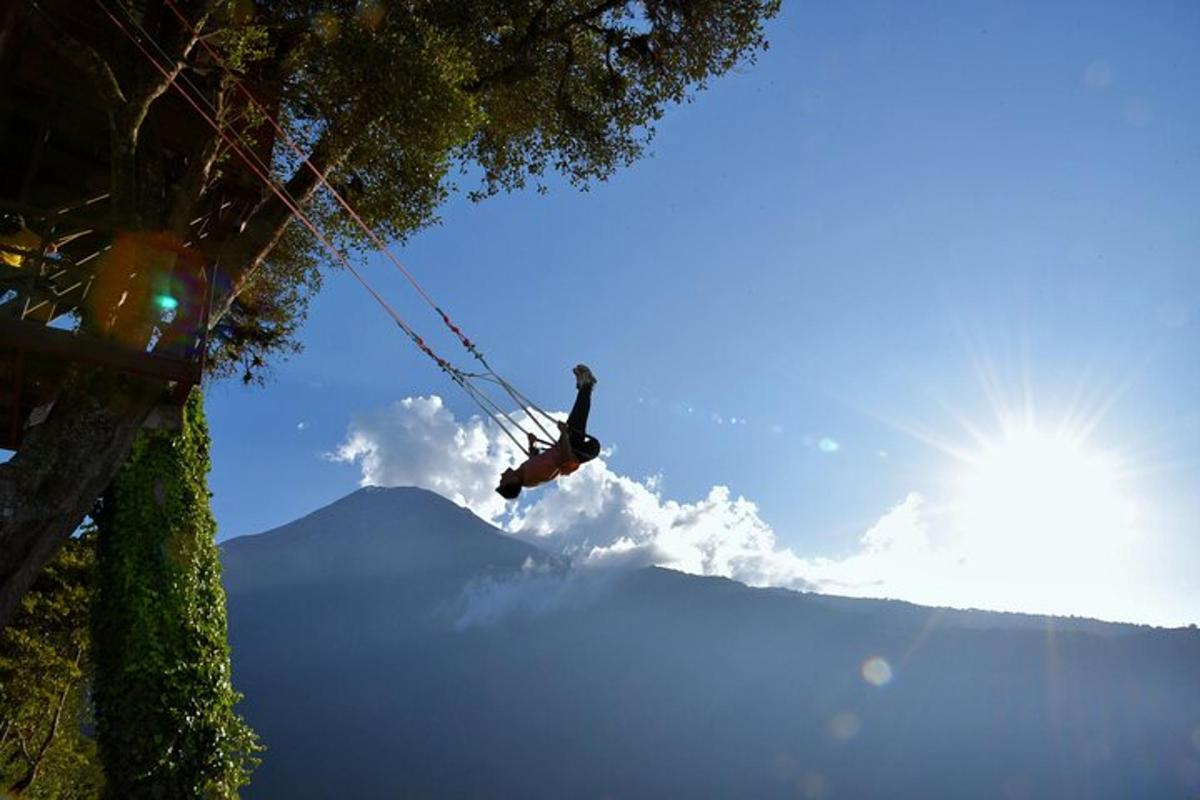 a person on a zip line in the sky