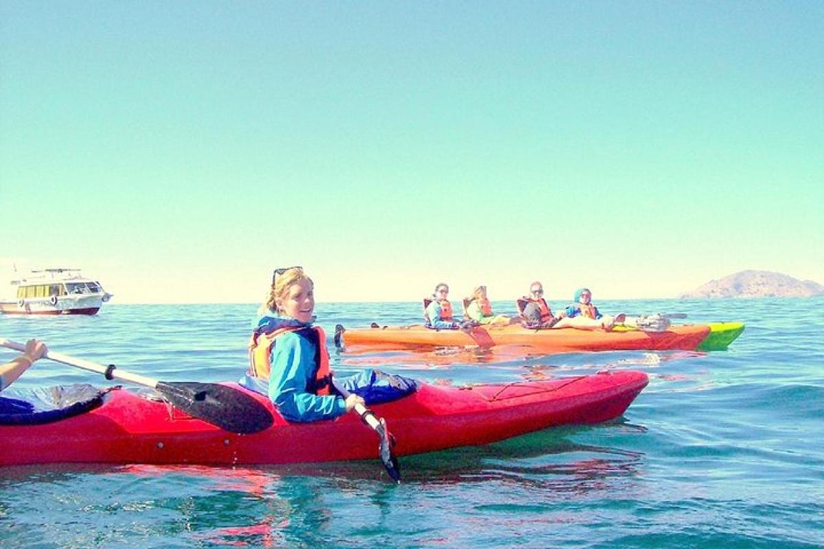 a group of people in kayaks in the water