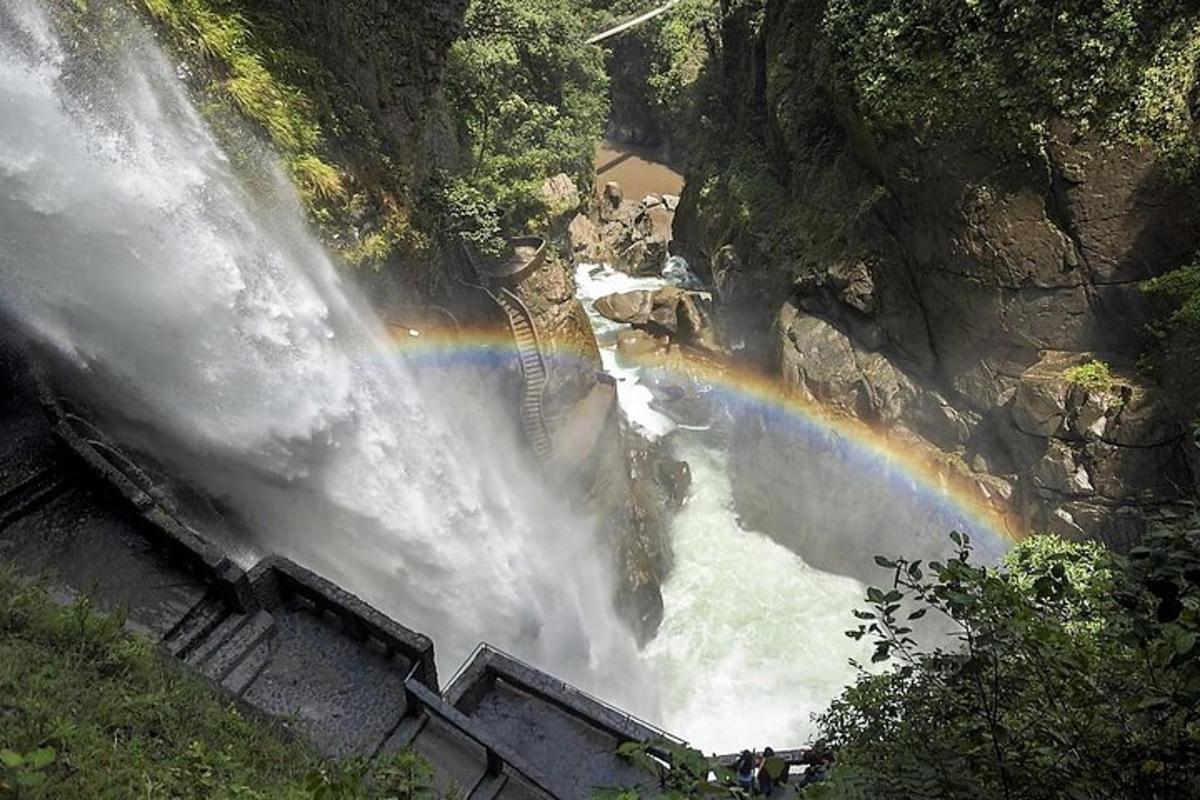 a waterfall with a rainbow in the middle of it