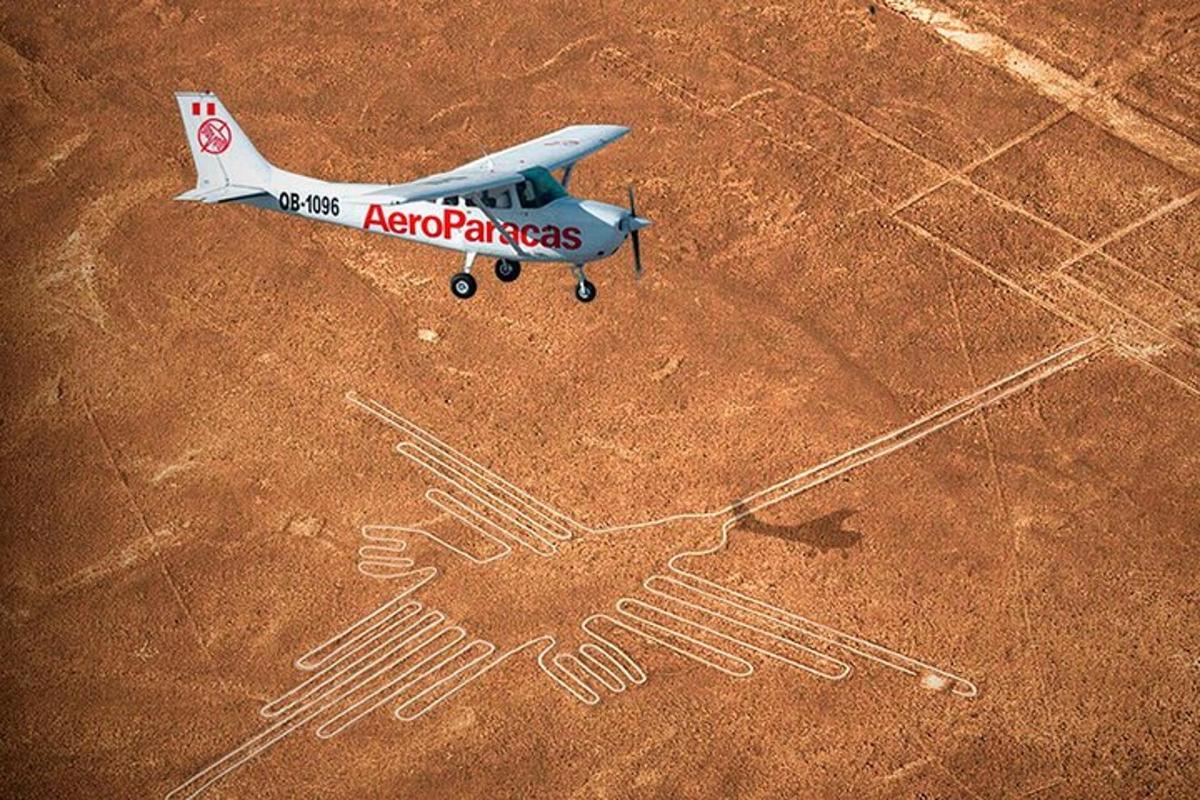 a small plane on the ground with a drawing on it