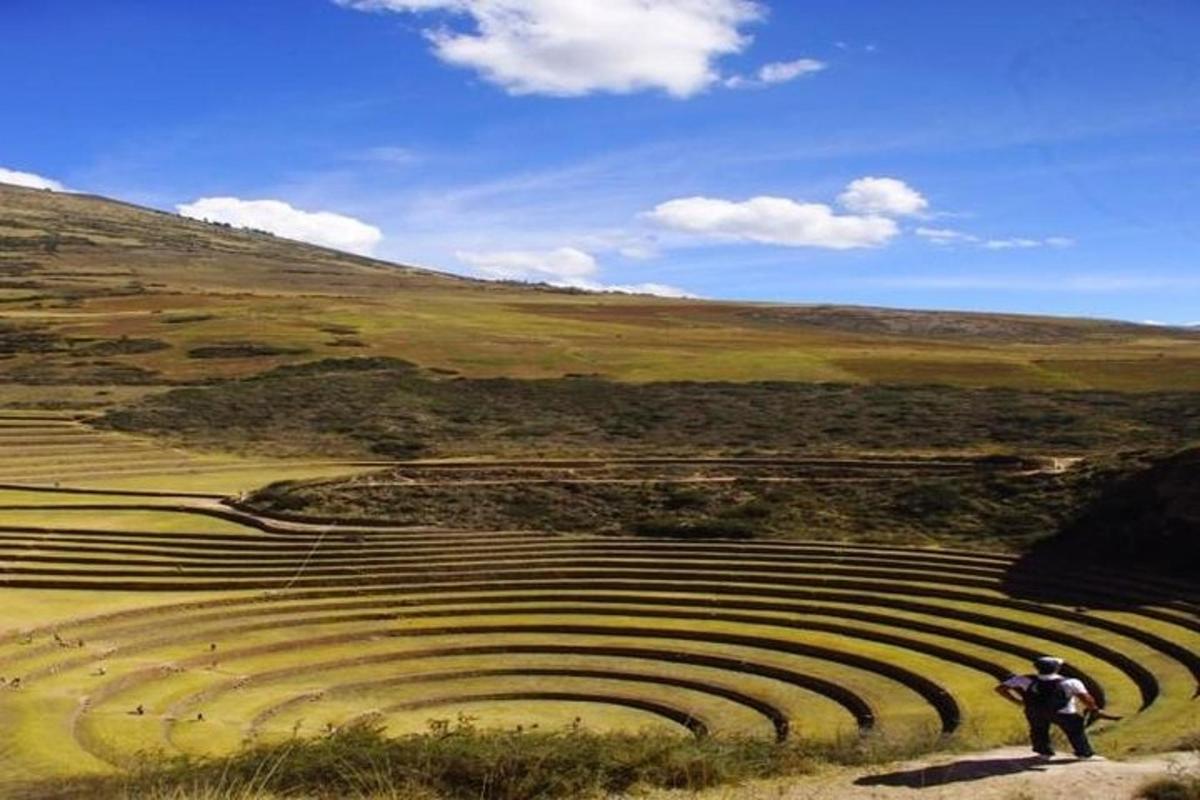 a man standing in front of an amphitheater