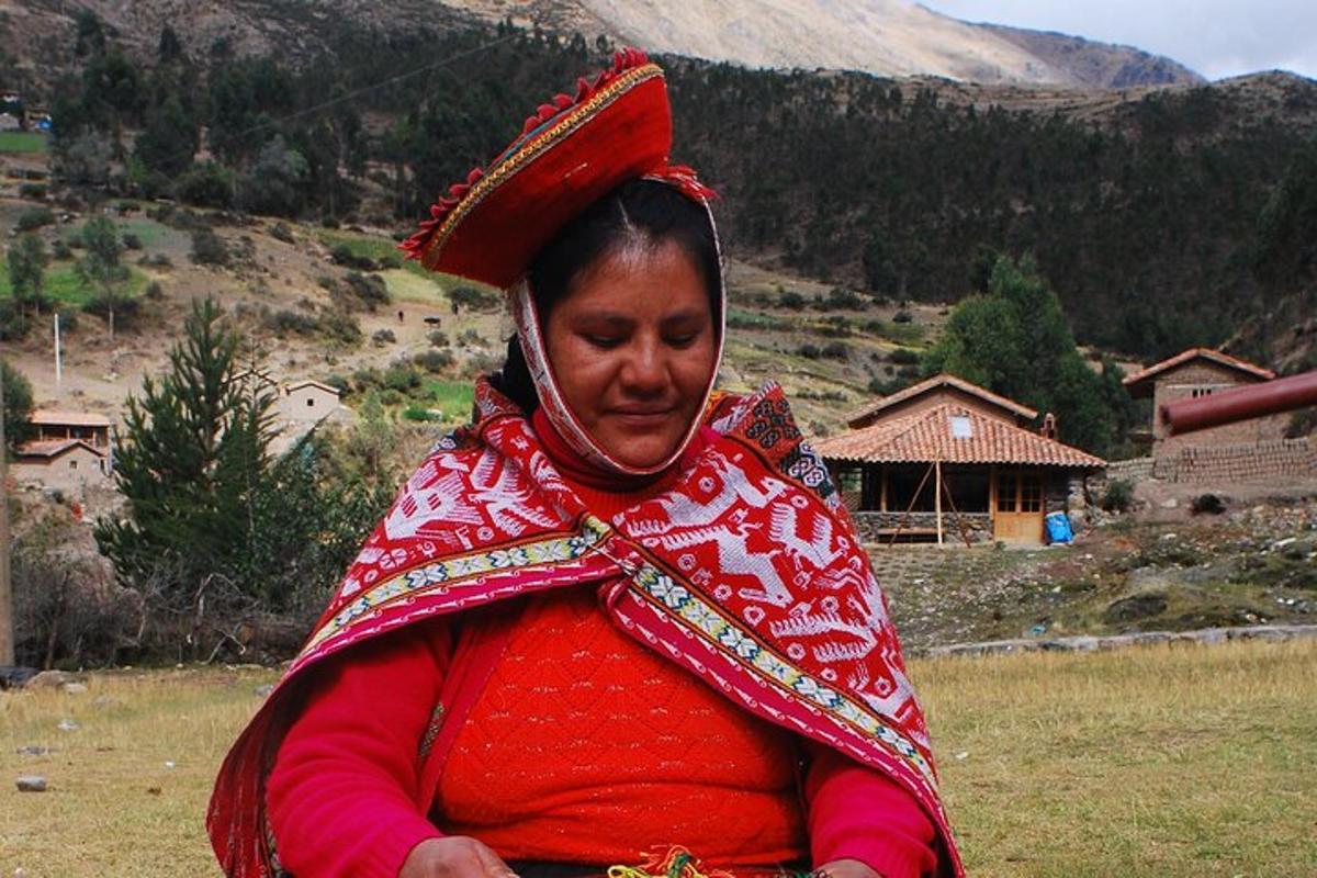 a woman in a red dress standing in a field