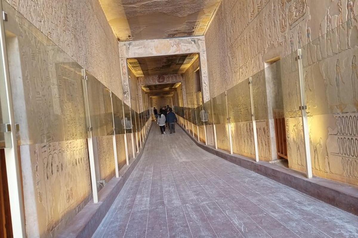 a hallway in a building with people walking down it