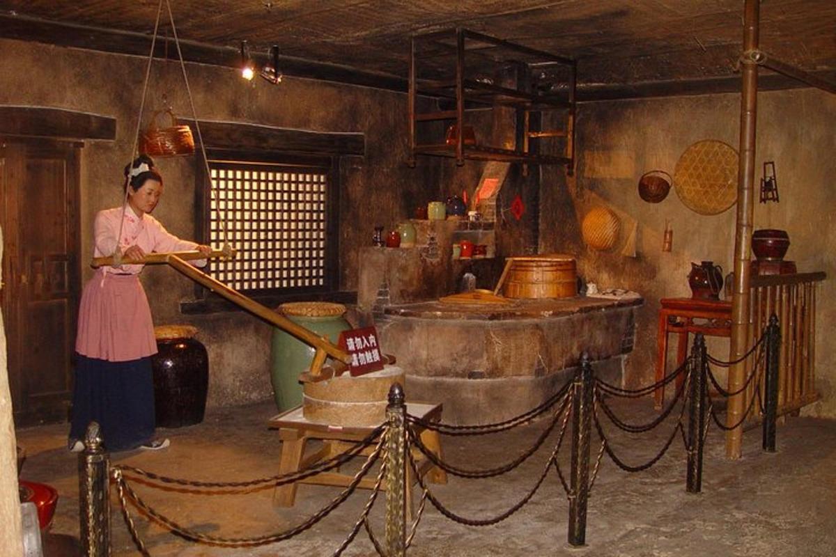 a woman in a kitchen preparing food in a kitchen