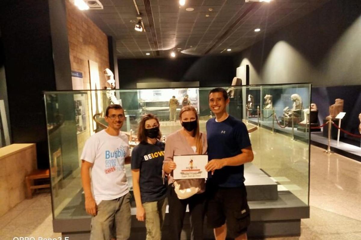 a group of people standing in front of a display case