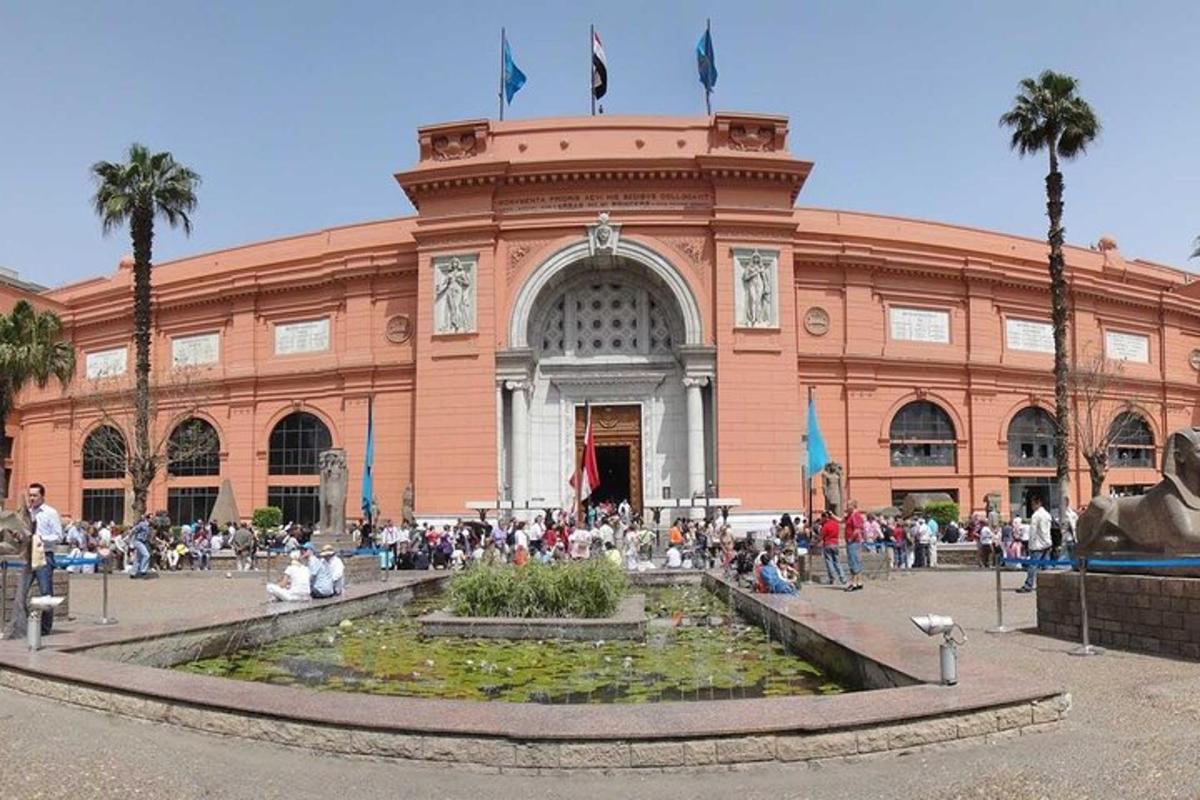 a large building with a fountain in front of it