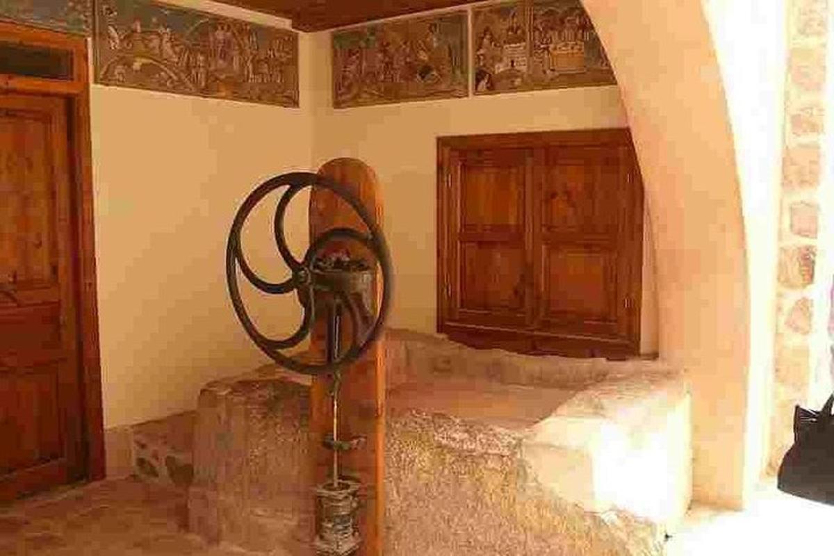 a room with a large sculpture in the corner of a room