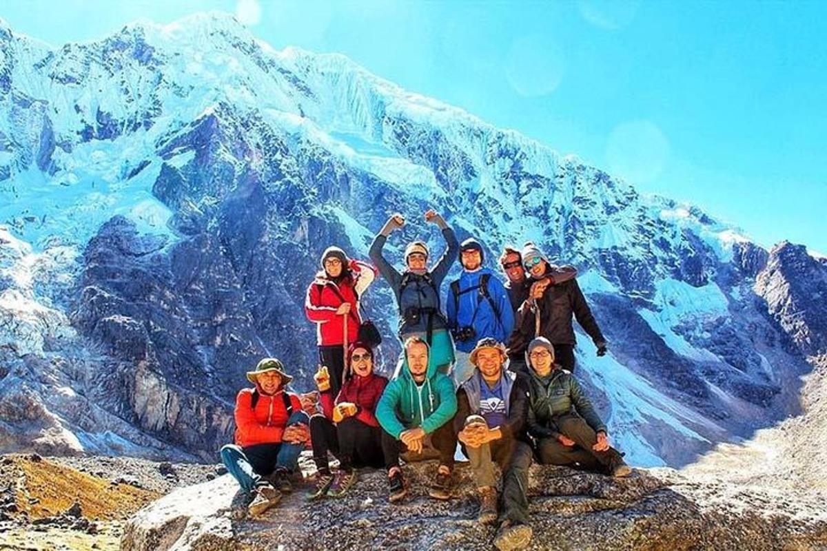 a group of people standing on top of a mountain