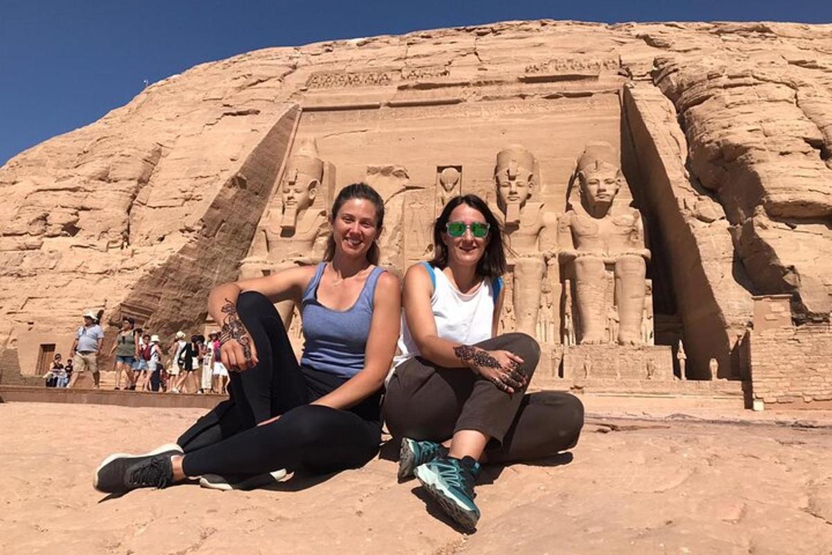 two women are posing in front of anaraohuments