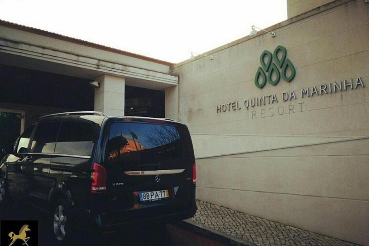 a black suv parked in front of a building