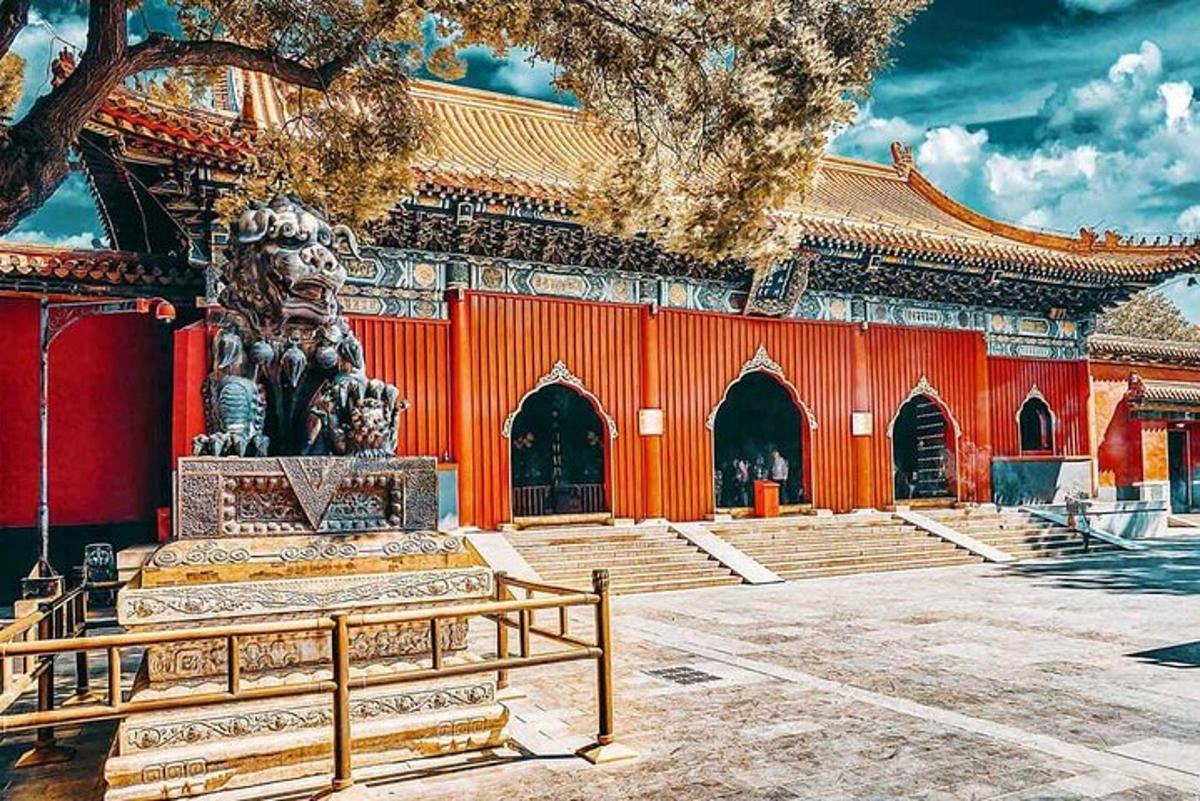 a temple with a bench in front of a building