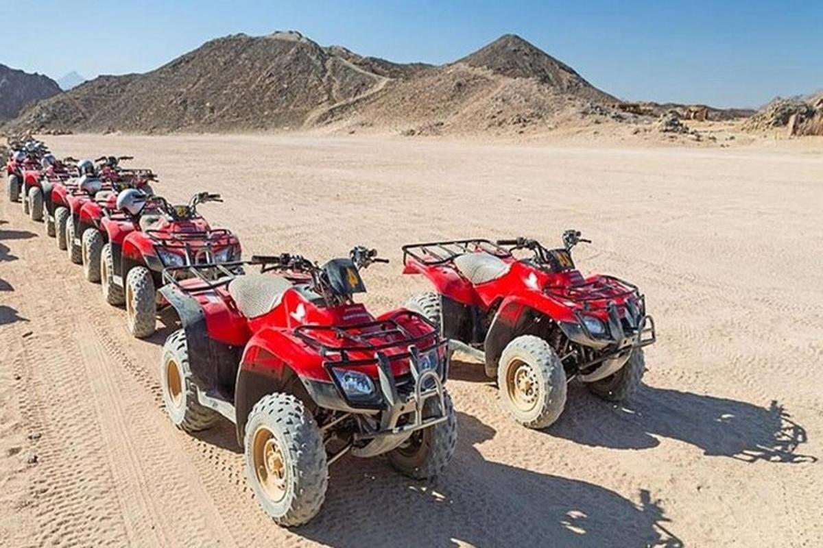 a row of atvs parked in the desert