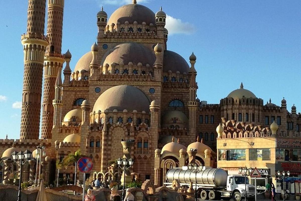 a large building with domes and a truck in front of it