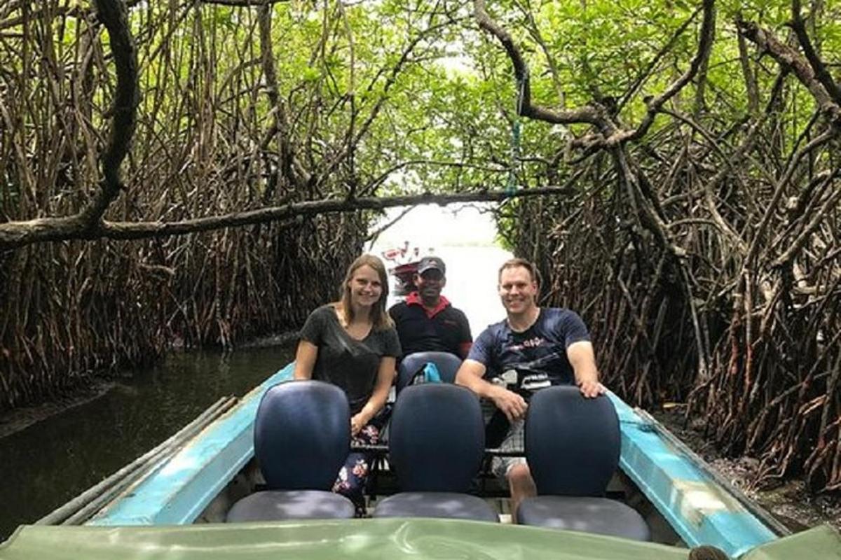 a group of people riding in a boat in the water