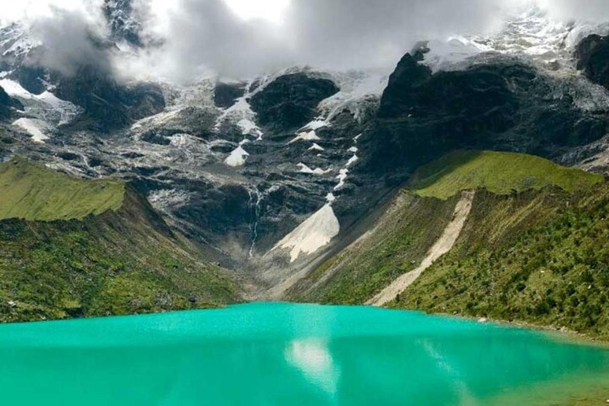 a view of a mountain with a blue lake