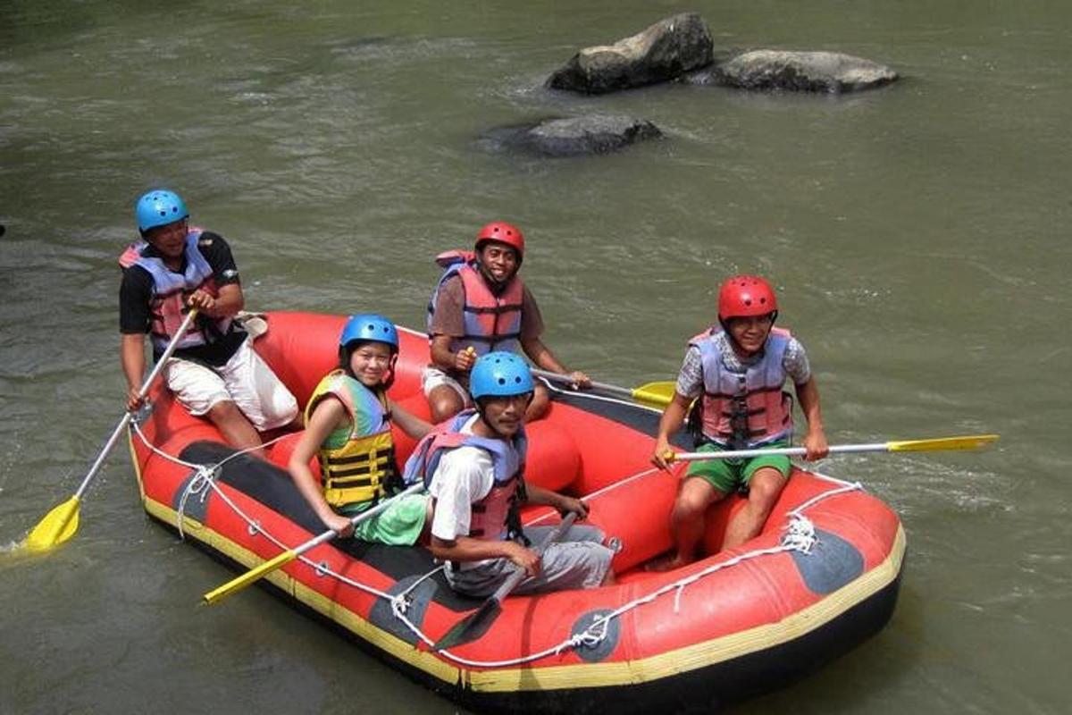 a group of people in a raft on a river