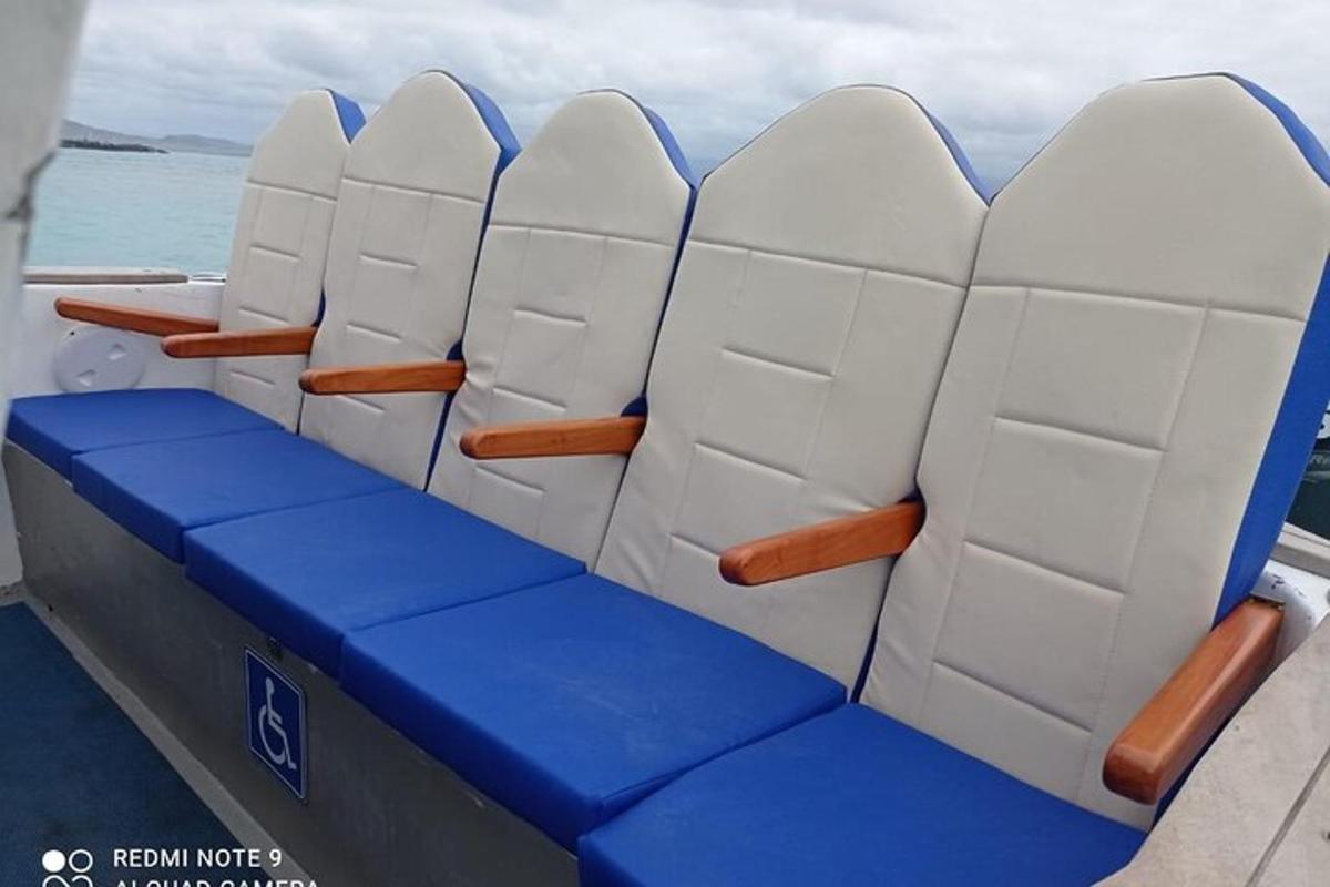 a seat on a boat with blue and white seats