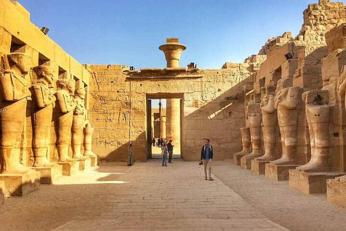 a group of people walking through the ruins
