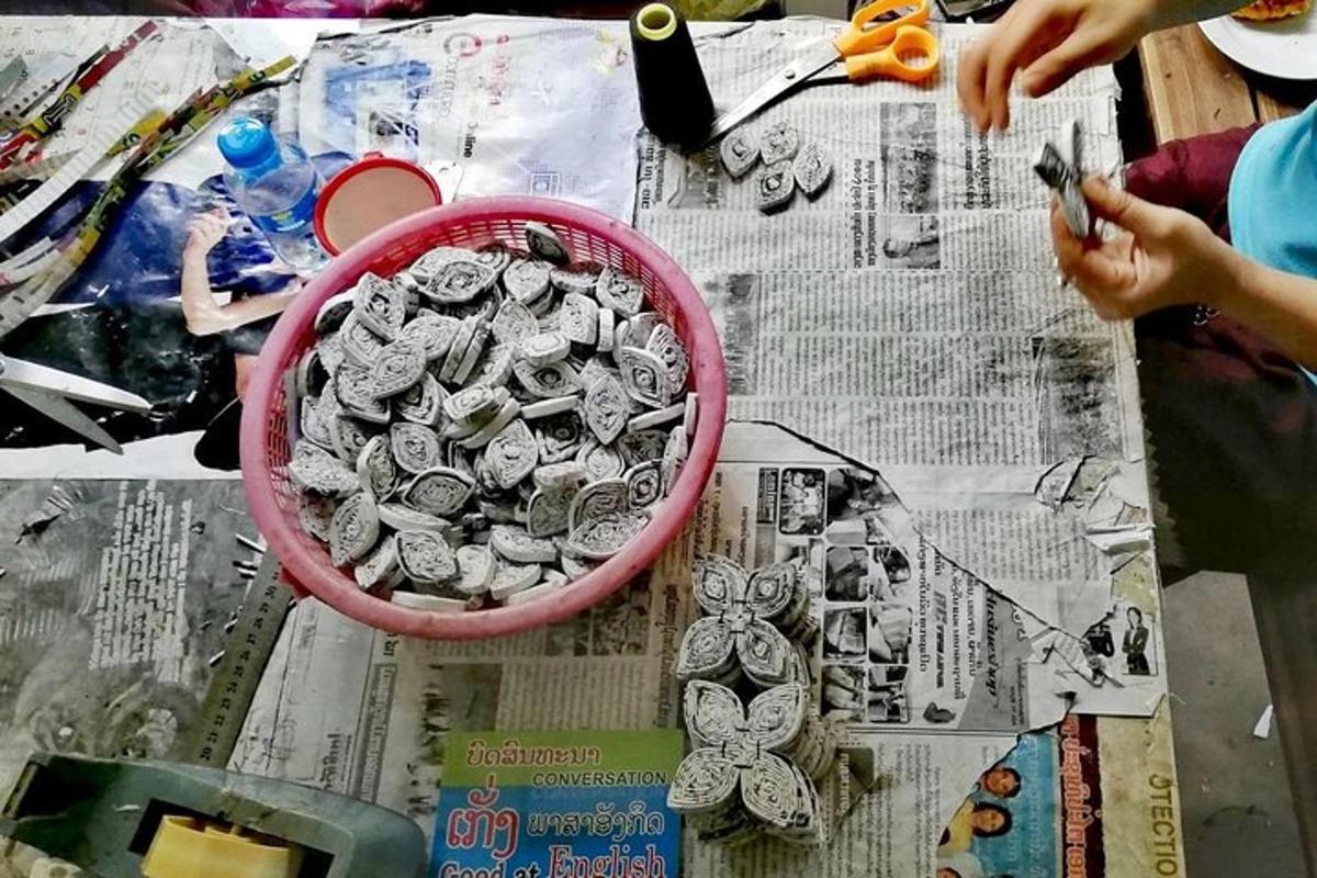 a table with a basket of metal butterflies on it