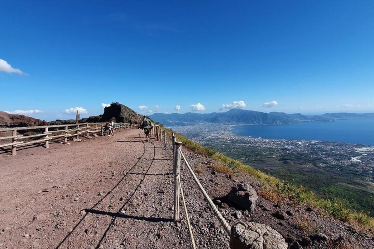 a path on top of a mountain with a view of the water