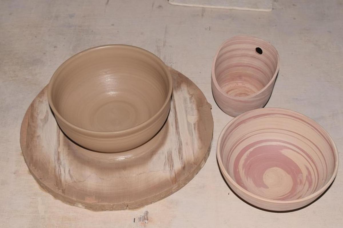 two clay pots sitting next to each other on a table