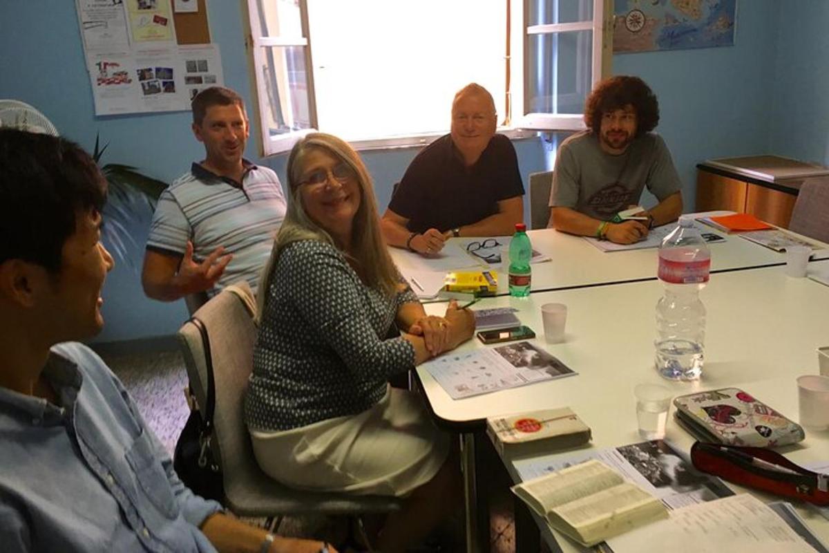 a group of people sitting around a table
