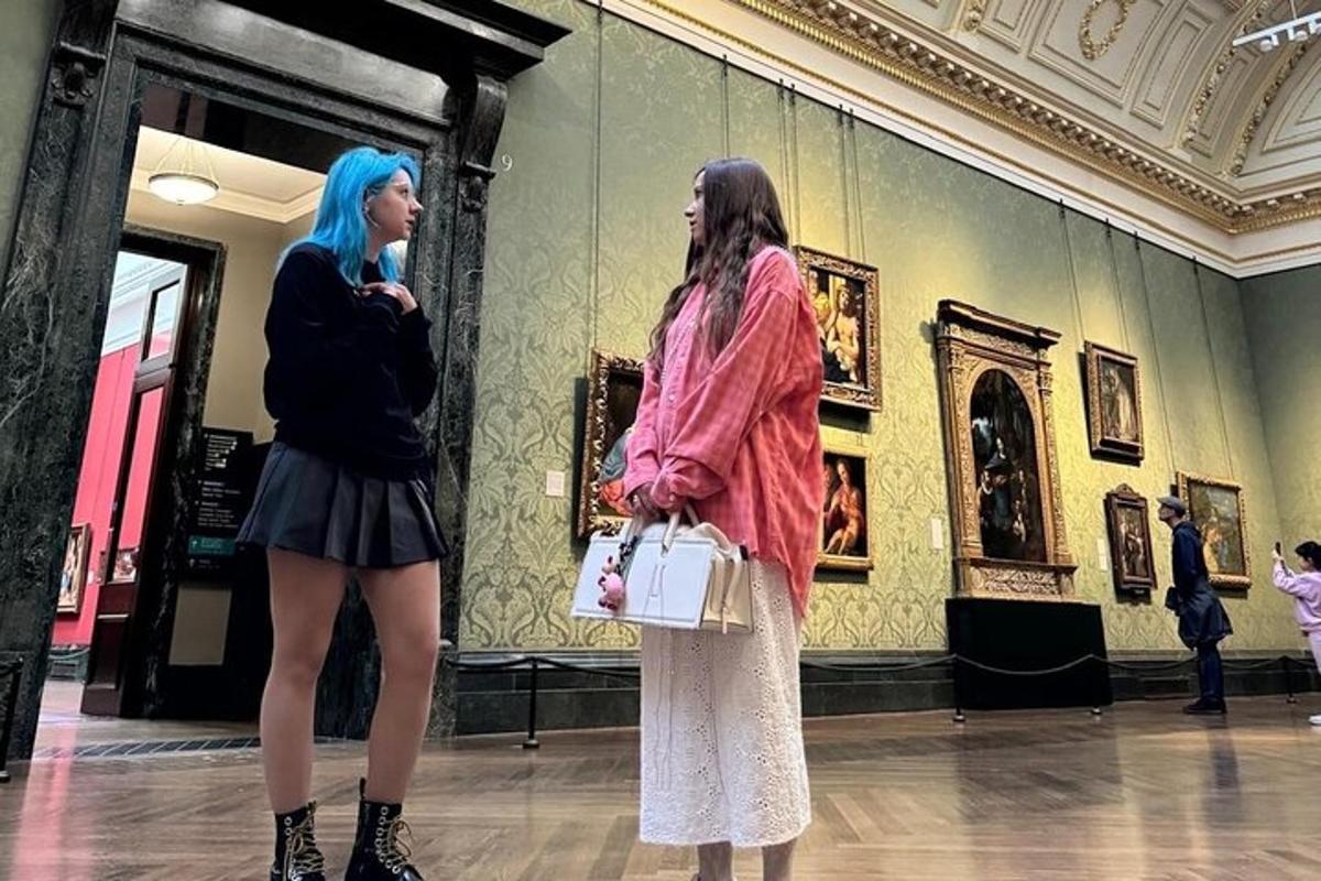 two women standing in a museum looking at art