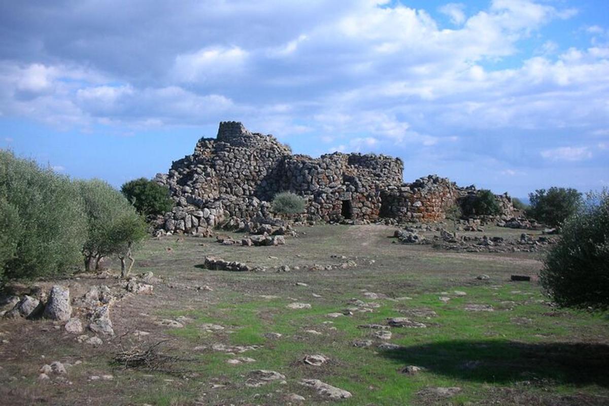 a large stone building sitting on top of a field