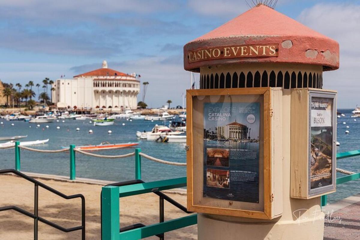 a ticket booth on the beach with a marina