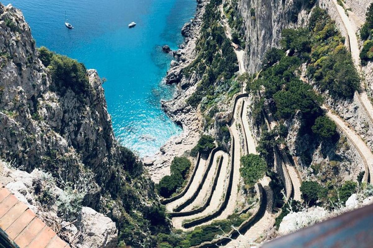 an aerial view of a mountain with the ocean