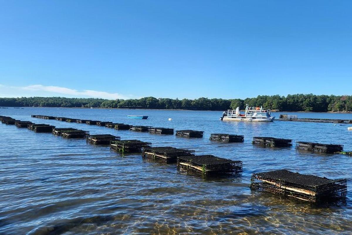 a long pier in the water with a boat
