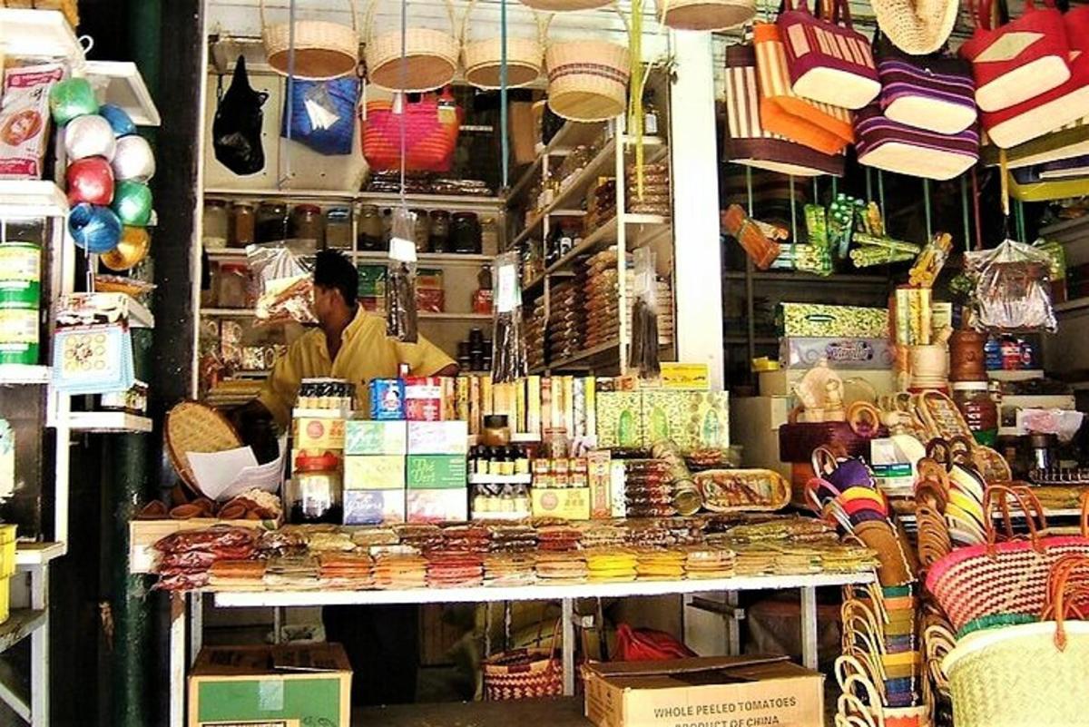 a man standing behind a counter in a store