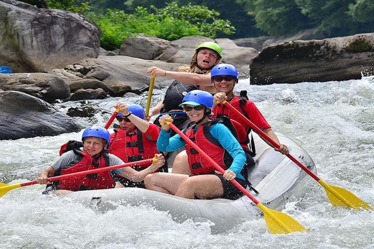 a group of people in a raft on a river