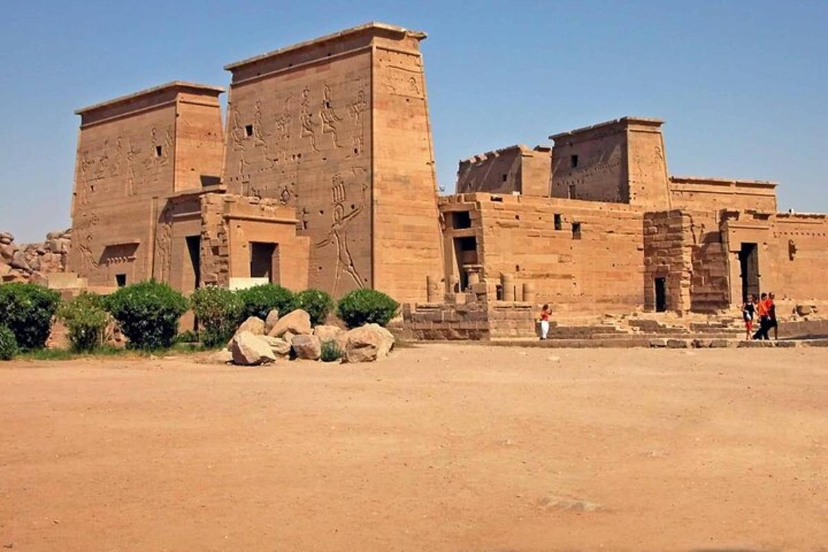 a large brick building with people standing in front of it