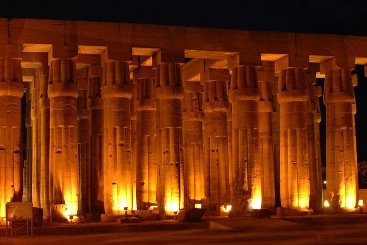 a wall with a bunch of tall statues
