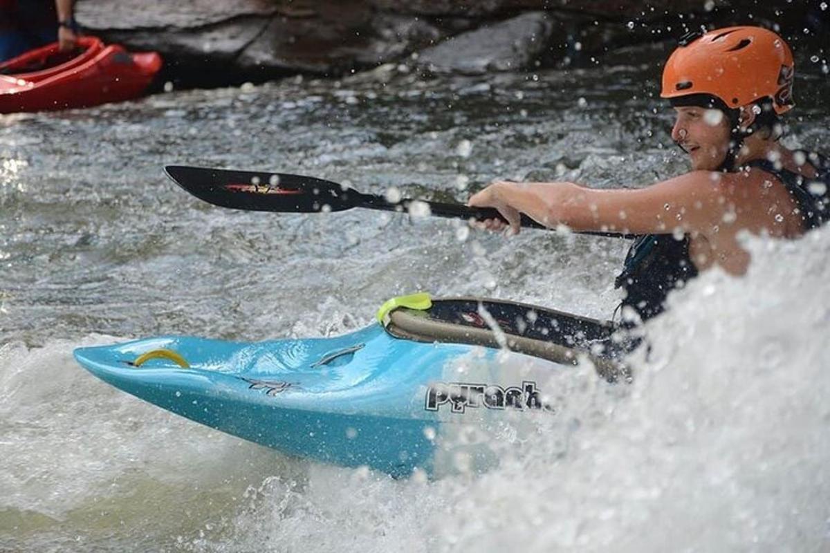 a man riding a kayak in the water