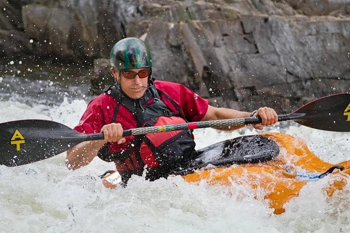 a man is in a raft in the water